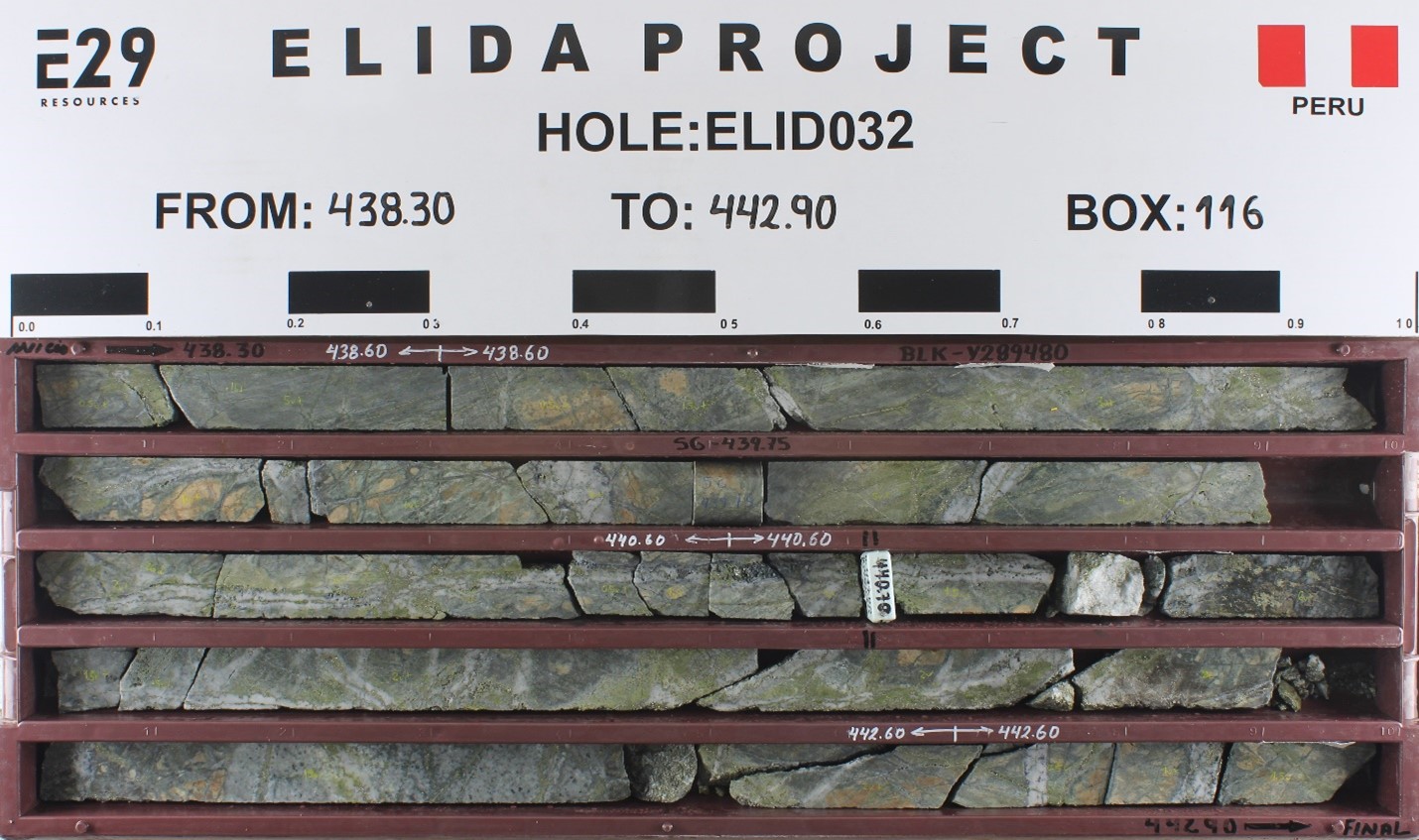 An example of porphyry style mineralization from hole ELID032. Strong, multiphase veinlets are developed in calcareous sandstone host rock. Carbonate-bearing host rocks result in a skarn alteration assemblage of garnet and diopside, which is consistently overprinted by all mineralized vein phases. Multiple generations of quartz (A and B types) and sulphide veinlets are visible. Hydrothermal potassium feldspar and biotite replacing primary sedimentary minerals reveal a potassic environment of formation. Samples pertaining to core in this box are: 436.6-438.6 m, 0.77% Cu, 0.038% Mo, 5.4 g/y Ag; 438.6-440.6 m, 0.89% Cu, 0.048% Mo, 7.4 g/t Ag; 440.6-442.6 m, 1.02% Cu, 0.029% Mo, 12.2 g/t Ag; 442.6-444.6 m, 0.49% Cu, 0.092% Mo, 4.6 g/t Ag. Core is NQ diameter (47.6 mm).